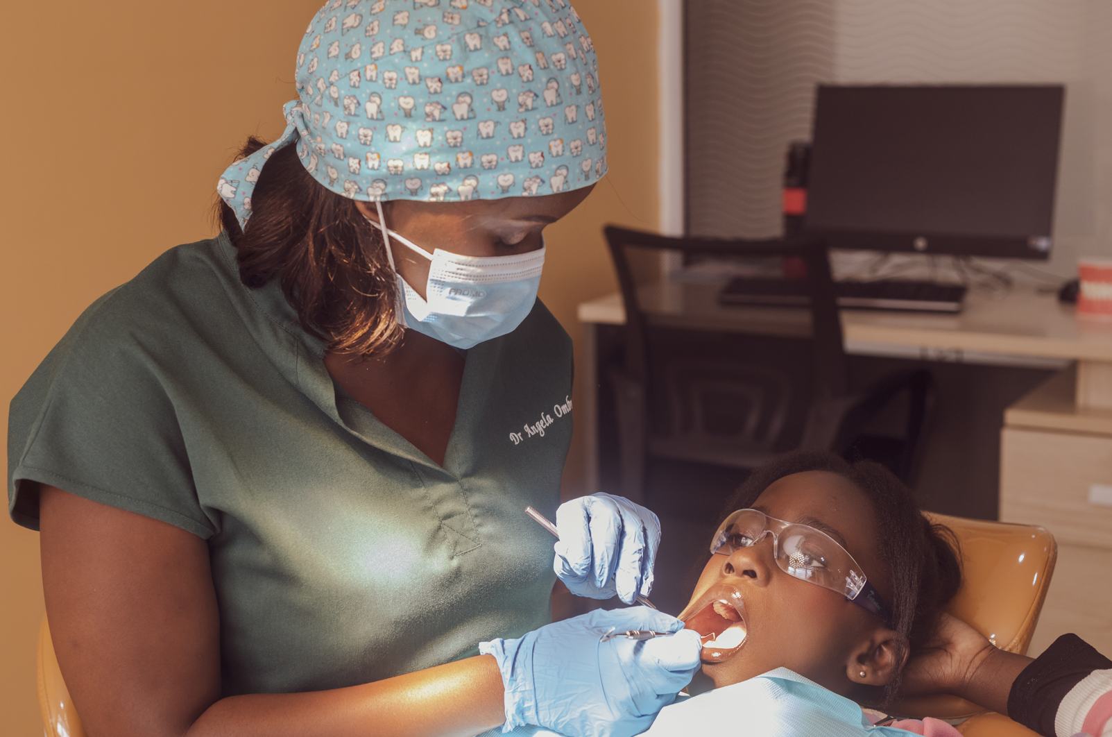 Dr. Angela Ombuna answering patient questions at Urban Smiles Dental